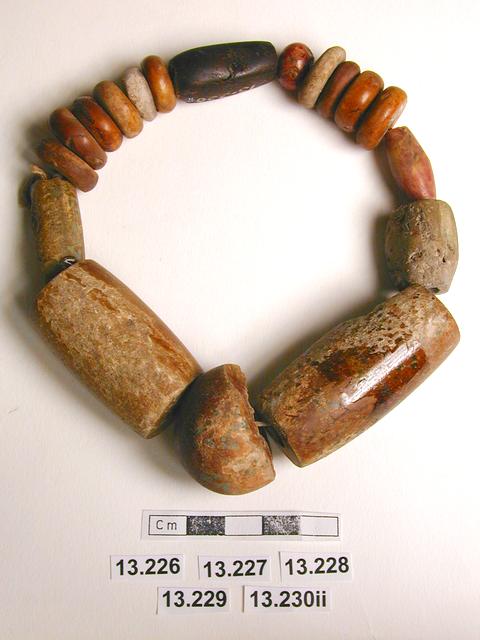 Image of votive offerings; beads (adornments)