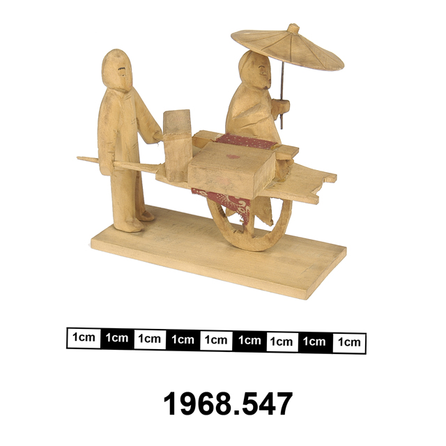 model wheelbarrow with figures