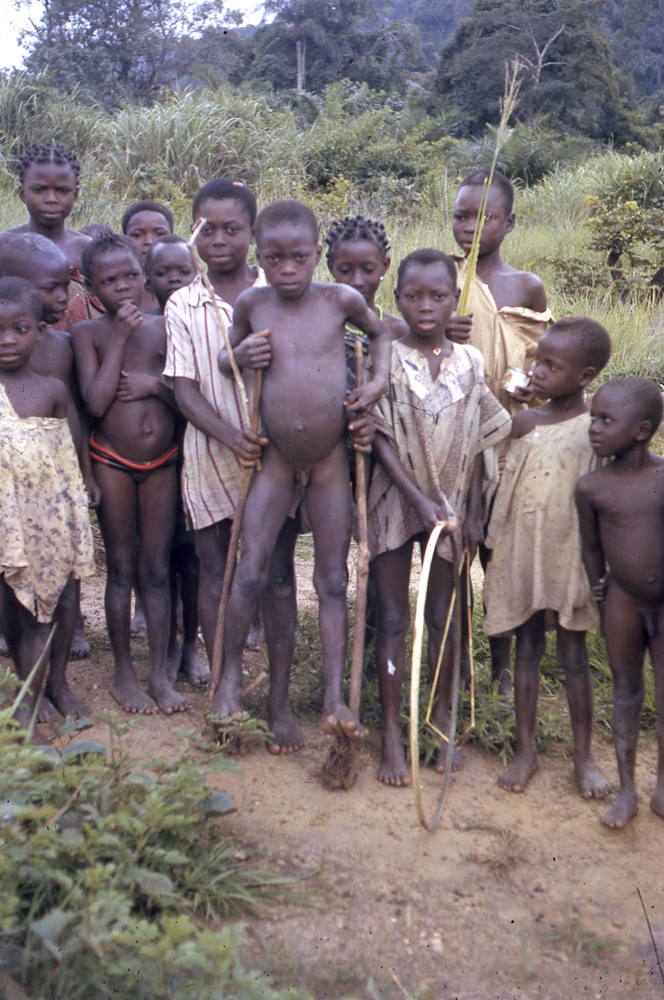 Image of Oyah children with stilts and hoops