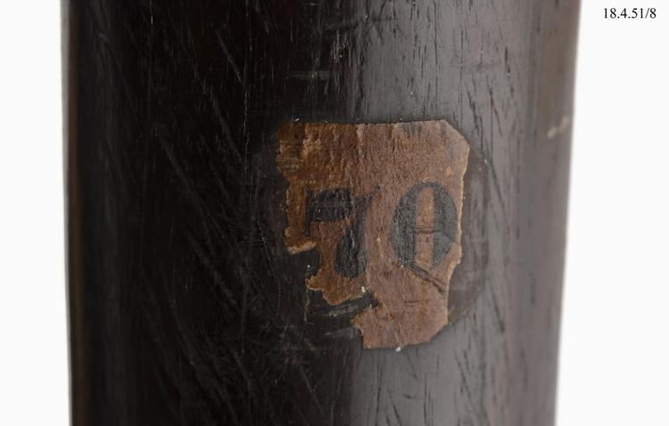 Detail view of label on handle of Horniman Museum object no 18.4.51/8