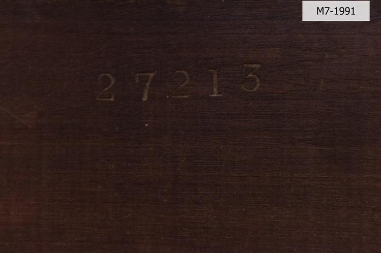 Detail view of number on frontal lid of Horniman Museum object no M7-1991