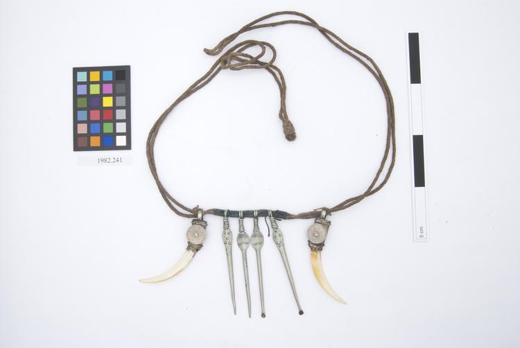 protective charm; chatelaine; amulet