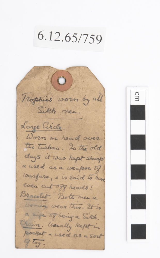 General view of label of Horniman Museum object no 6.12.65/759