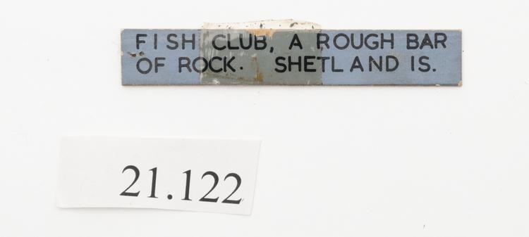 General view of label of Horniman Museum object no 21.122