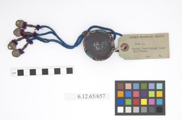 General view of label of Horniman Museum object no 6.12.65/657