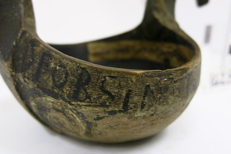 General View of the writing on the side of Horniman Museum object no 1628