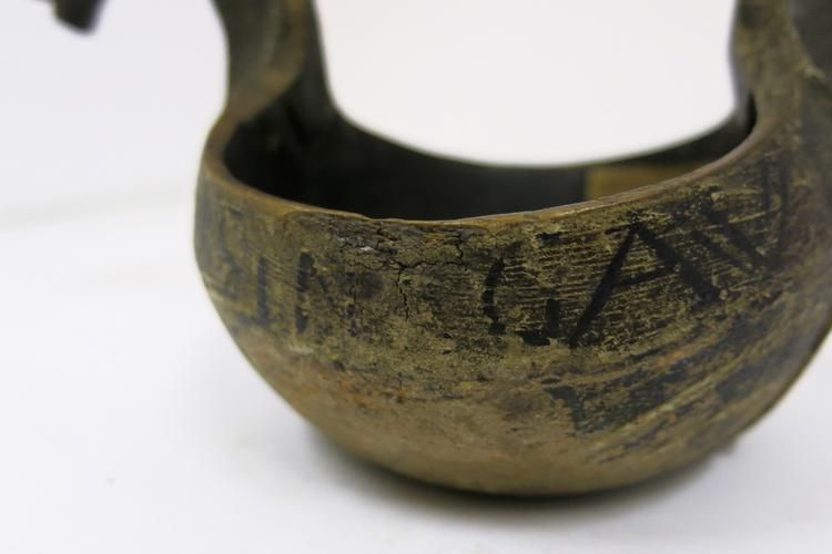General View of the writing on the side of Horniman Museum object no 1628
