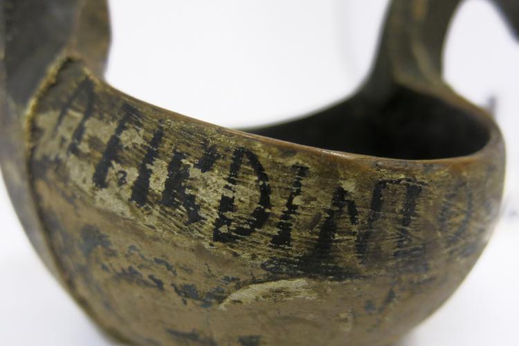 General View of the writing on the left side of Horniman Museum object no 1628