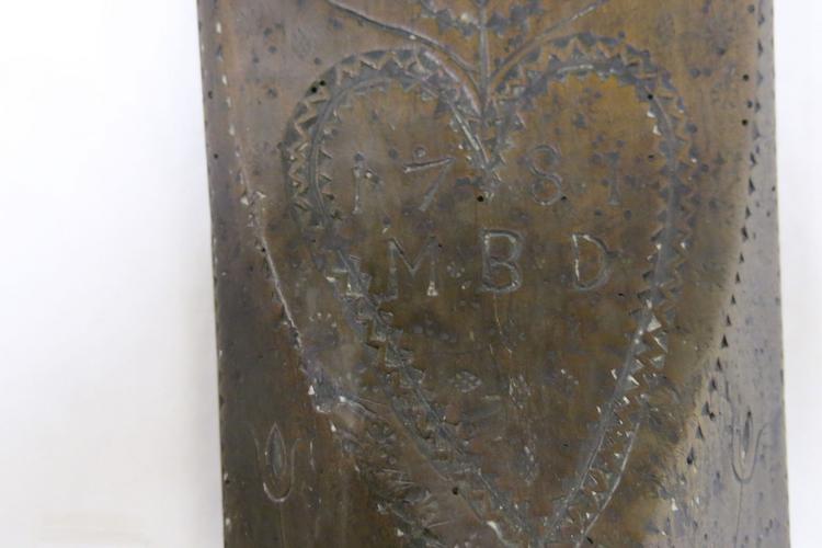 General view of initials on front of Horniman Museum object no 30.9.65/5a