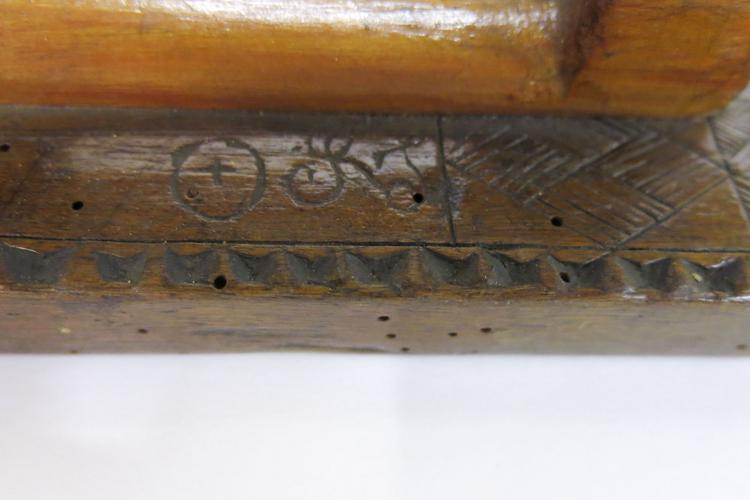 General view of the initials on the side of Horniman Museum object no 0.194