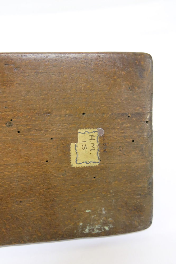 General view of the labels on the bottom of Horniman Museum object no 3.416