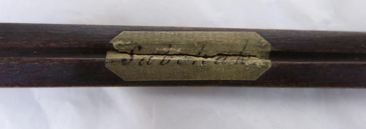 General view of the label on the bottom of Horniman Museum object no 32.54