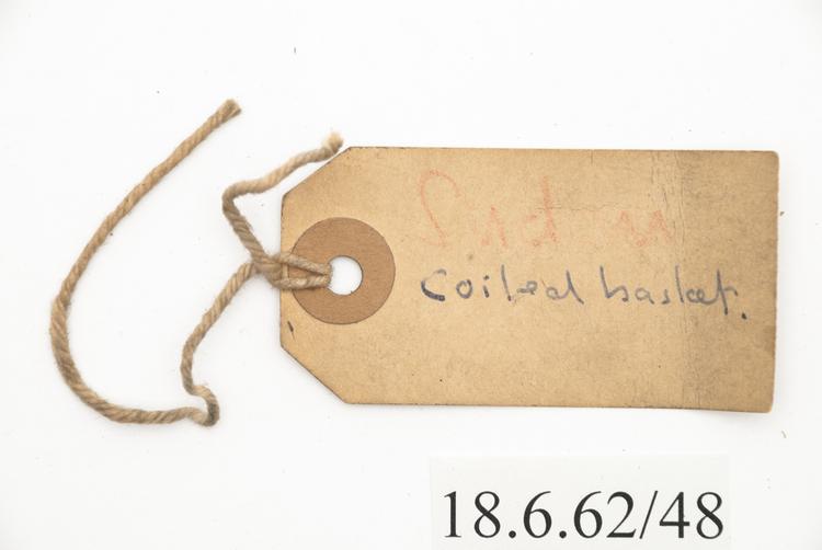 General view of label of Horniman Museum object no 18.6.62/48