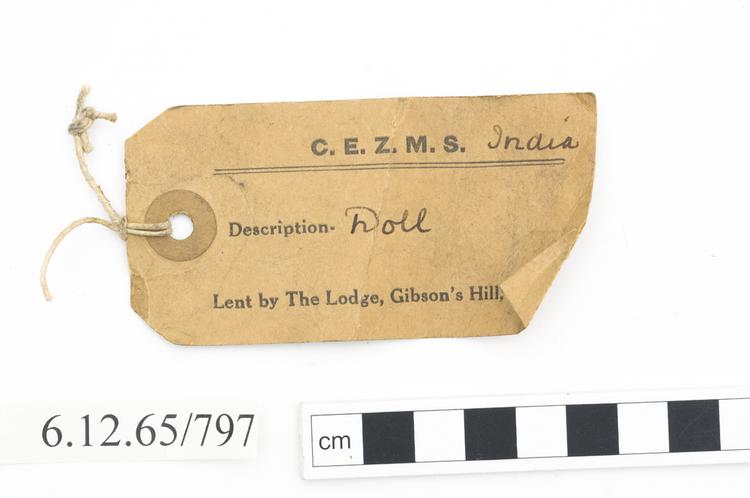 General view of label of Horniman Museum object no 6.12.65/797