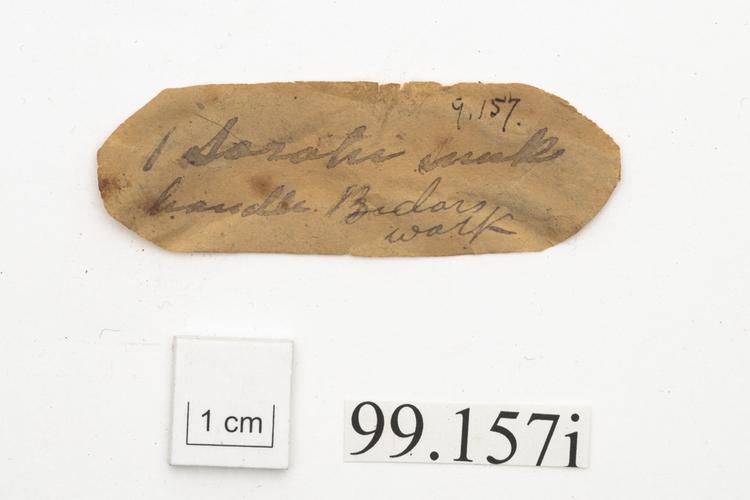 General view of label of Horniman Museum object no 99.157i