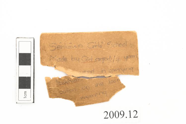 General view of label of Horniman Museum object no 2009.12