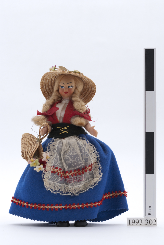 Image of doll (pastimes: toys); basket (containers)