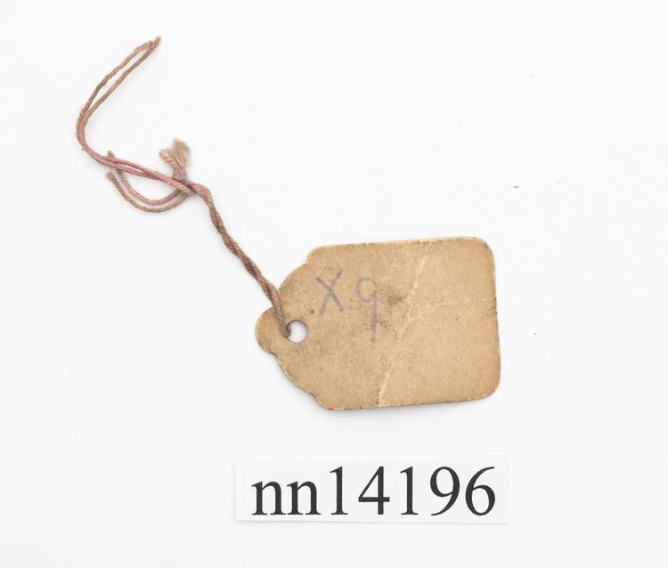 Rear view of label of Horniman Museum object no nn14196