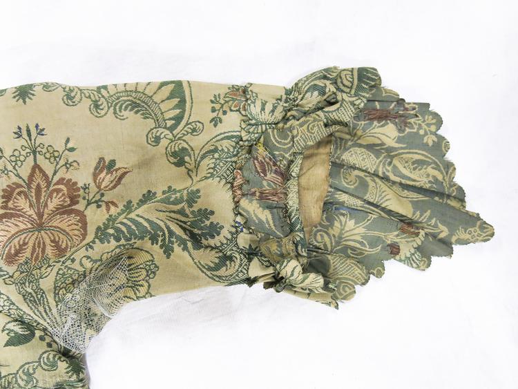 Detail view of left sleeve of Horniman Museum object no nn4914