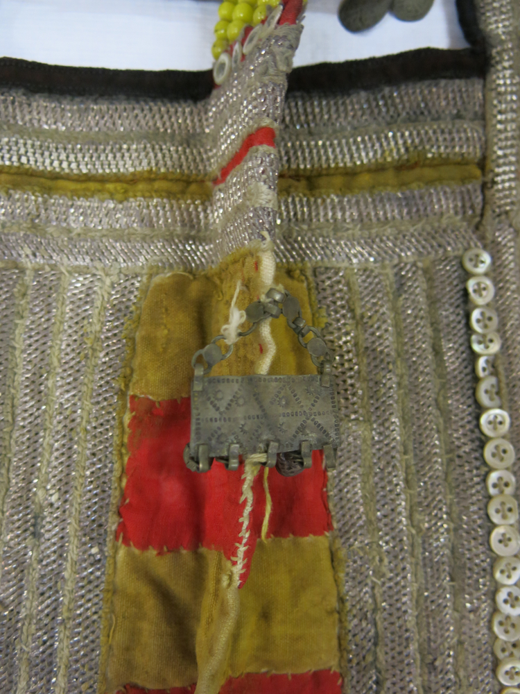Detail view of embroidery of Horniman Museum object no 1969.174