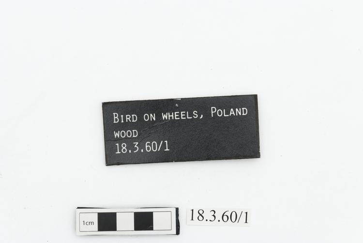 General view of label of Horniman Museum object no 18.3.60/1