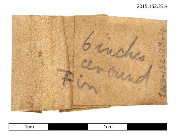 General view of spare string identification label with instruction for tuning pin winding of Horniman Museum object no 2015.152.23.4