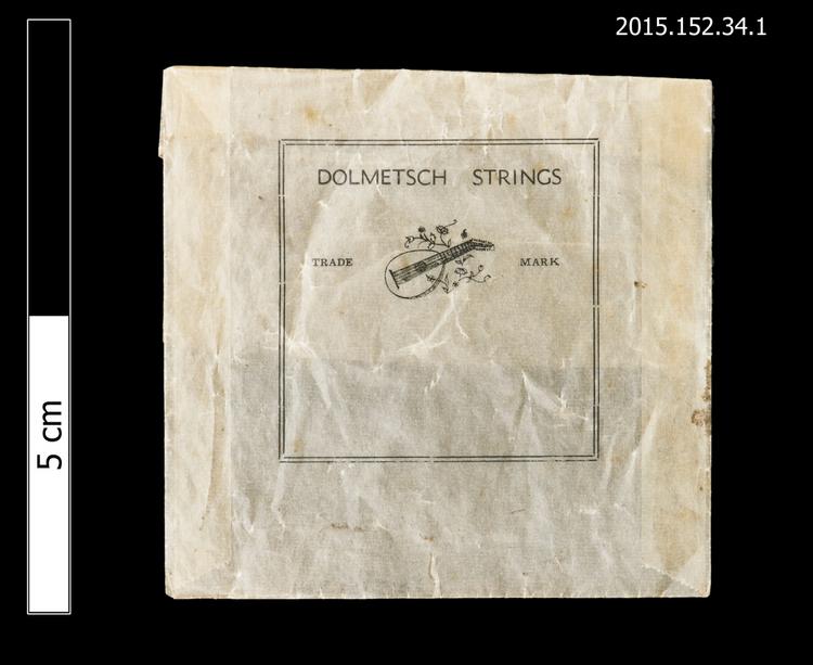 General view of envelope for spare string with Dolmetsch logo of Horniman Museum object no 2015.152.34.1