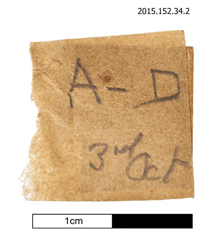 General view of spare string identification label of Horniman Museum object no 2015.152.34.2