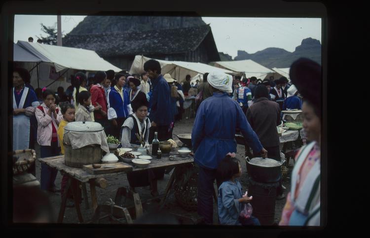 Image of 35mm slide: Market. Peter Baldwin wanted to buy a coolie hat but couldn’t find one.