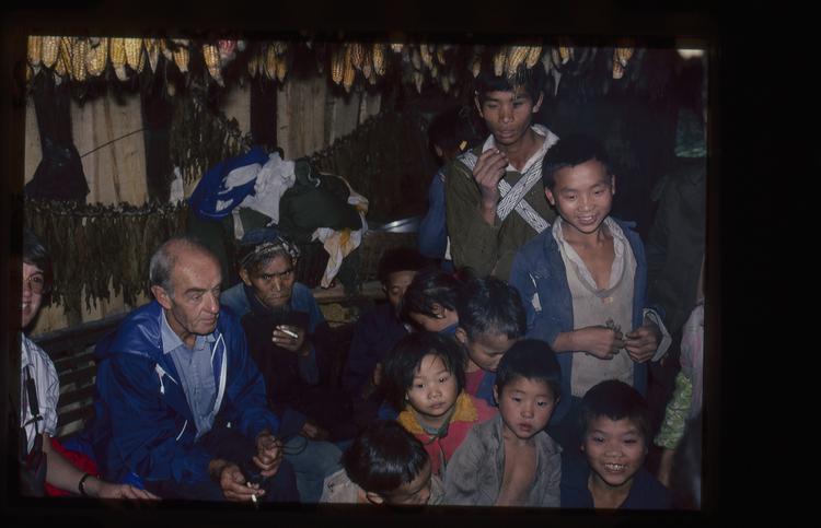 Image of 35mm slide: Being entertained inside a house