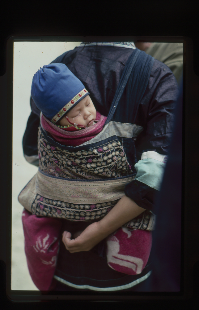 Image of 35mm slide: Baby in baby carrier