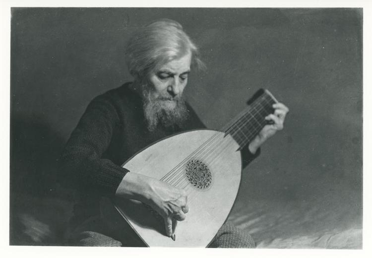 Image of Black and white photograph of Arnold Dolmetsch playing the lute, circa mid-1930s