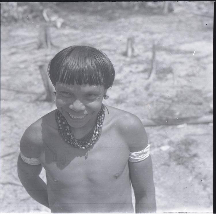 Image of Black and white negative of a smiling Wai Wai man