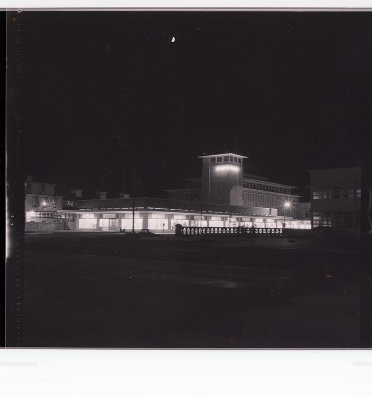 Image of Black and white negative of building at night (building called 'Bookers')