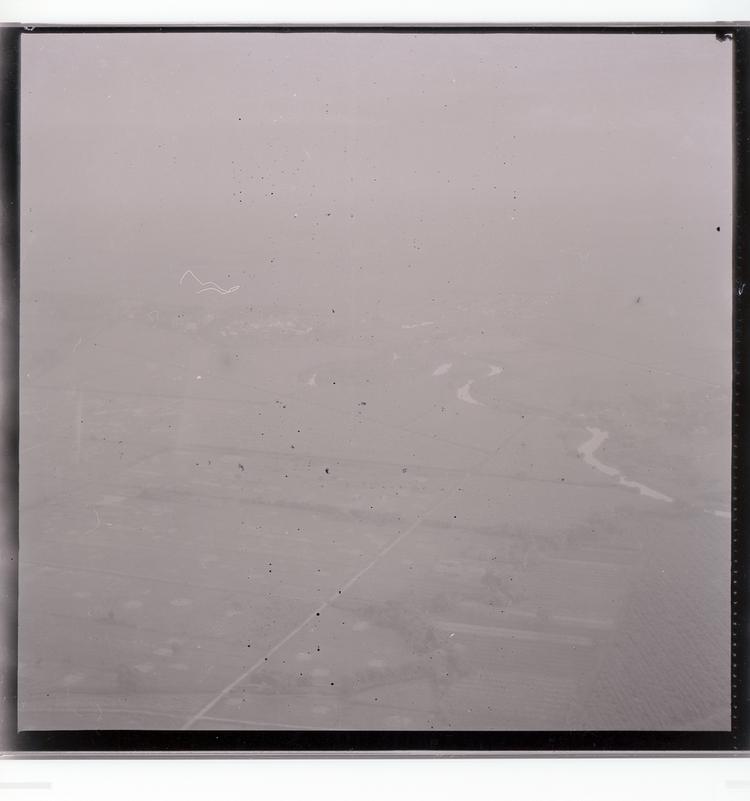 image of Black and white negative of Guyana from the air, fields and a windy river in view