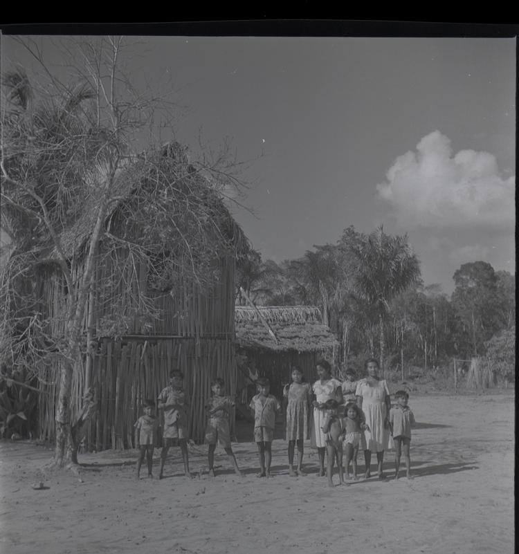 Image of Black and white medium format negative (scanned positive) of a family group in front of a two storey home