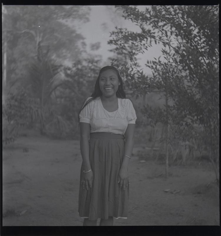 Image of Black and white medium format negative (scanned positive)of a woman in blouse and skirt