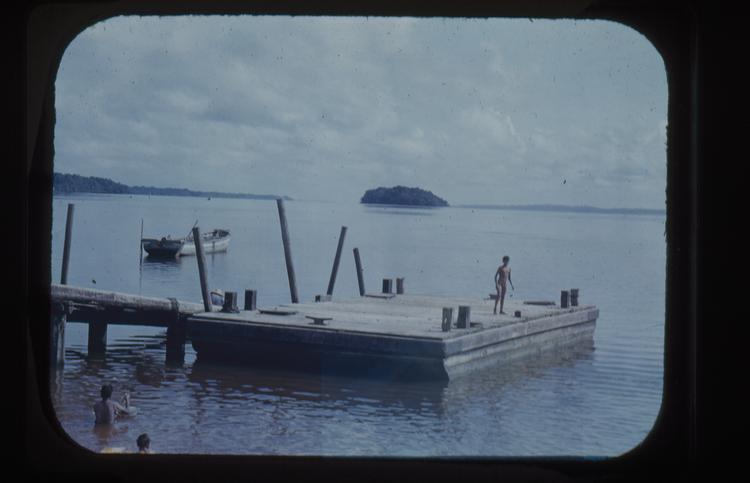 image of Colour slide of jetty and a landing stage on a wide river