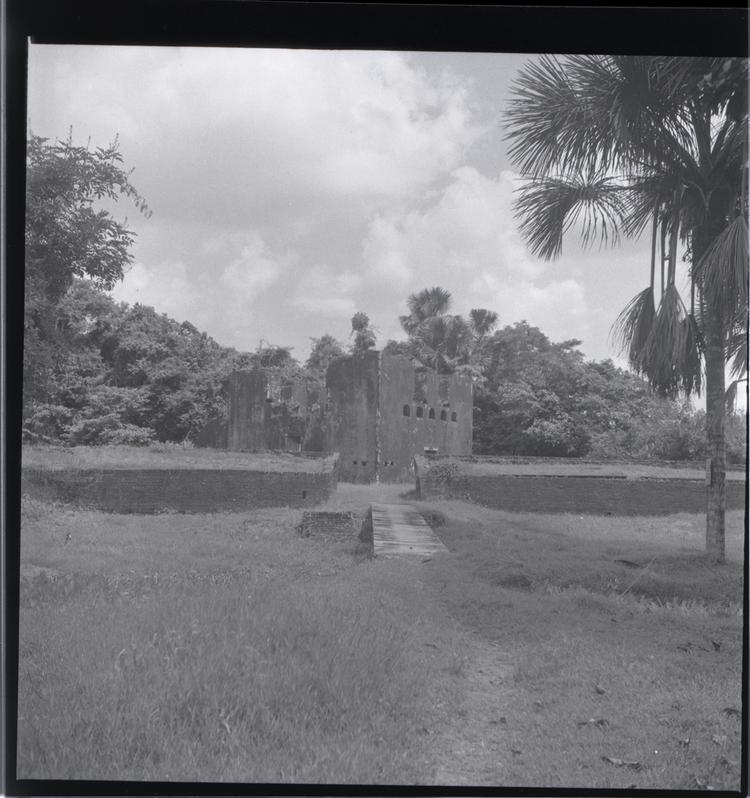 Black and white medium format negative of fort in landscape