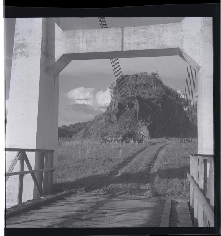Black and white medium format negative of close up on bridge showing structure of bridge and road leading to it