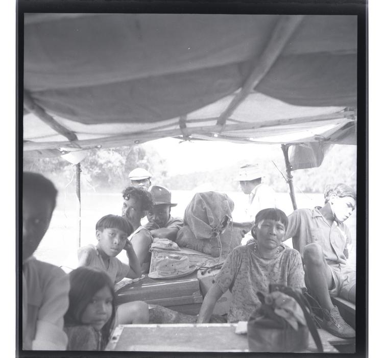 image of Black and white medium format negative of people in a boat (close up from within boat)