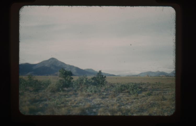 image of Colour slide of landscape with mountain in distance