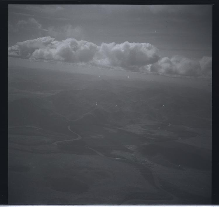 Image of Black and white print view from plane with river visible