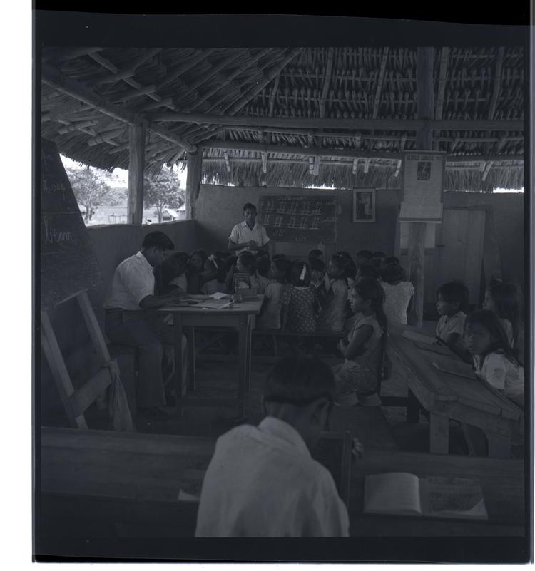 image of Black and white medium format negative of a crowded schoolroom