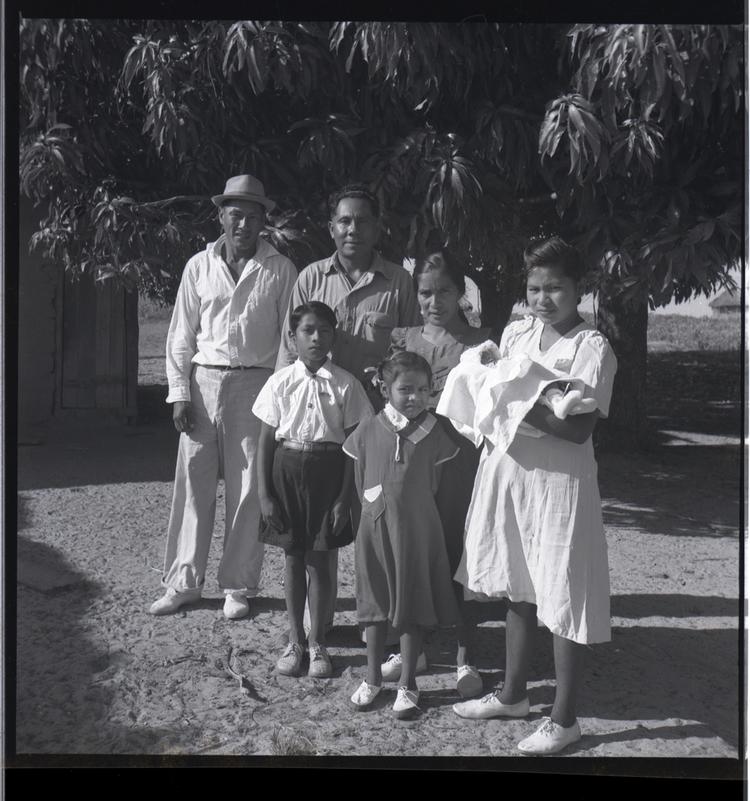 Image of Black and white medium format negative of group of people - four adults, two children and a baby