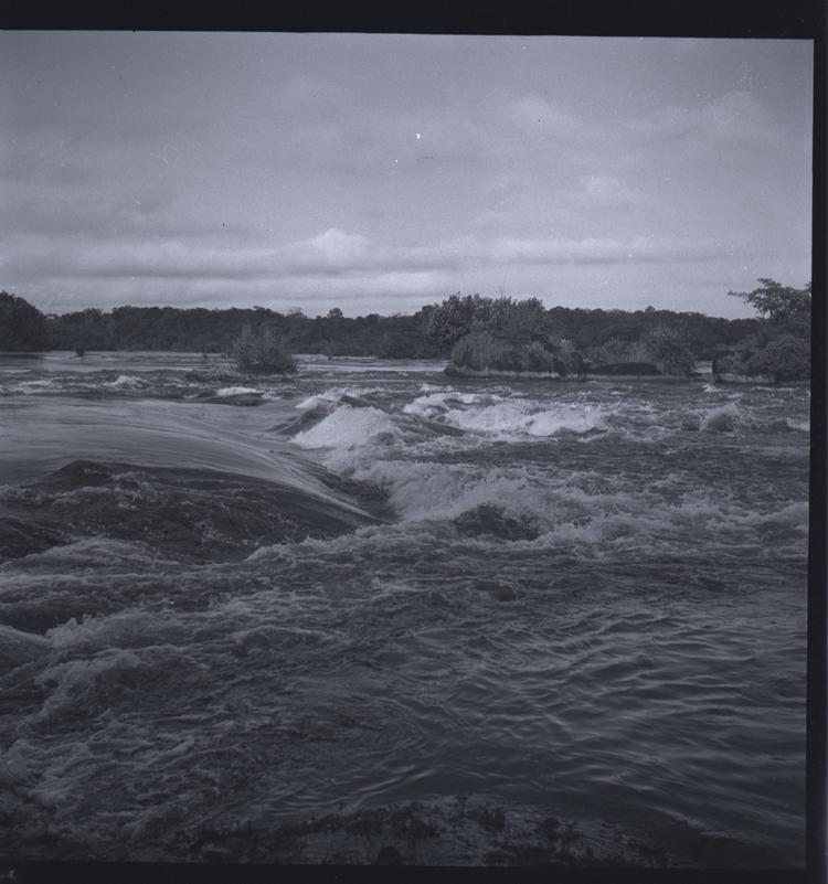 image of Black and white medium format negative of rough river water