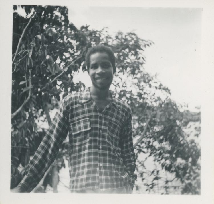 image of Black and white print of young man in check shirt