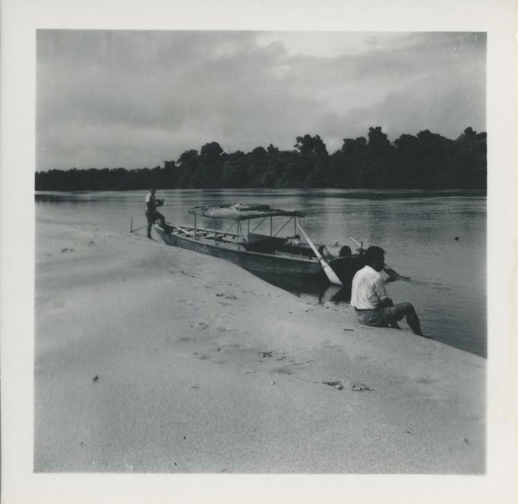 image of Black and white print of moored boat and two men