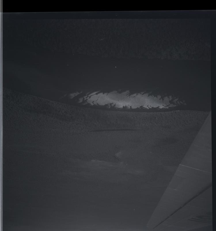Image of Black and white medium format negative of aerial view of sandbanks with plane wing lower right corner