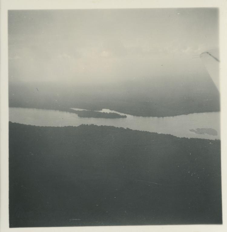 image of Black and white print aerial view of river from plane